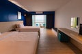 Dark blue tone interior of hotel room with sea view from window. interior room warm light style Royalty Free Stock Photo