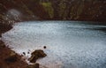 Dark blue water of Kerid lake located inside the volcanic crater in the Southern Iceland. Raindrops and small waves caused by wind Royalty Free Stock Photo