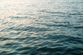 Dark blue water surface with sunset light redlection. Sea or ocean water background Royalty Free Stock Photo