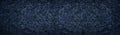 Dark blue wide background. Rough crumpled surface large panoramic texture