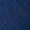 Dark blue wool fabric texture. The dense, interlocking fibers create a slightly fuzzy Royalty Free Stock Photo