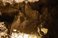 Dark blurred abstract background of stalactites, stalagmites and stalagnates in Sfendoni cave, underground, horizontal