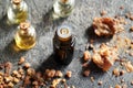 A dark bottle of essential oil with myrrh resin Royalty Free Stock Photo