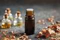 A dark bottle of essential oil with myrrh resin Royalty Free Stock Photo