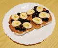 Dark bread with peanut butter, black currant and banana slices Royalty Free Stock Photo