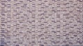 Dark brick wall pattern with chaotic masonry order. Background texture or resource for 3d texturing. Many bricks in big modern Royalty Free Stock Photo