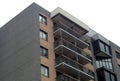 Dark bricks building corner window and balcony residential architecture Royalty Free Stock Photo