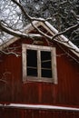 Dark broken window on an old wooden building Royalty Free Stock Photo