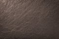 Dark bronze background of natural slate. Texture of stone Royalty Free Stock Photo