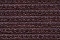 Dark brown background from checkered pattern textile, closeup. Structure of the wicker fabric macro. Royalty Free Stock Photo