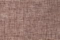 Dark brown background of dense woven bagging fabric, closeup. Structure of the textile macro. Royalty Free Stock Photo