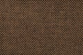 Dark brown background of dense woven bagging fabric, closeup. Structure of the textile macro.