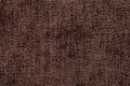 Dark brown background from soft textile material. Fabric with natural texture. Royalty Free Stock Photo