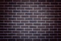 Dark brown brick wall, decorative brick tiles. Background texture of brick wall. Vignette.Copy space Royalty Free Stock Photo