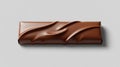 Dark brown chocolate bar with smooth and wavy surface on a light gray background Royalty Free Stock Photo