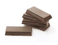 Dark Brown Chocolate Pieces Heap on White Background Royalty Free Stock Photo