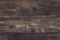 Dark brown faded wooden table, top view. Shabby horizontal boards. Abstract texture, weathered timber background. Rustic template Royalty Free Stock Photo