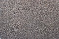 Dark brown granulated animal feed background texture Royalty Free Stock Photo
