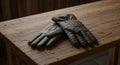 Dark Brown Leather Gloves on Wooden Table Royalty Free Stock Photo