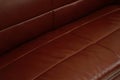 Dark Brown leather sofa, close up detail. Furniture showroom photography Royalty Free Stock Photo