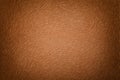 Dark brown matte background of suede fabric, closeup. Velvet texture Royalty Free Stock Photo