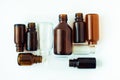 Dark brown phials on white background. Small empty bottles Royalty Free Stock Photo