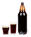 Dark brown plastic bottle of beer or kvass with glass cup isolated on a white background. Royalty Free Stock Photo