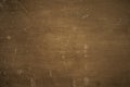 Dark brown plywood background. Texture dirty cracked painted chipboard Royalty Free Stock Photo