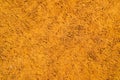 Dark brown pressed hard textured relief sand. The background