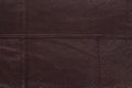 Dark brown stitched leather background. Royalty Free Stock Photo