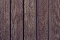 Dark brown wood texture background. Dark brown wooden fence. Dark wooden boards close-up. Pattern on dark wood backdrop.  Wood bro Royalty Free Stock Photo