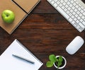 Dark Brown Wooden Desk with Stationery and Electronics Royalty Free Stock Photo