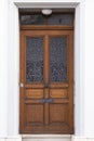 Dark brown wooden door with metal ornaments Royalty Free Stock Photo