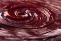 dark burgundy spiral of wet paint, background, texture, pattern, wallpaper.