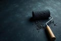 Dark charcoal paint roller and spilled pigment on a textured surface. Generative AI Royalty Free Stock Photo