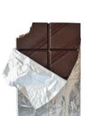 Dark chocolate bar in silver foil packaging top view isolated Royalty Free Stock Photo