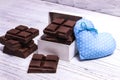 Dark chocolate bars and blue heart