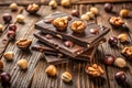 Dark Chocolate Bars with Walnuts and Hazelnuts in a Rustic Setting image photo Royalty Free Stock Photo