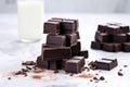 dark chocolate blocks stacked on a white marble countertop Royalty Free Stock Photo