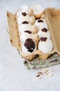 Dark chocolate brownie dessert in egg shells. Easter or funny kids party concept. White stone background.