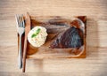 Dark chocolate chip brownie with whipped cream and cutlery Royalty Free Stock Photo