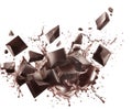 Dark Chocolate Chunks Splashing in Liquid Chocolate on White Background pieces breaking Royalty Free Stock Photo