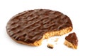 Dark chocolate coated digestive biscuit isolated on white. Partially eaten with crumbs