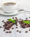Dark chocolate decorated with coffee beans and cup of coffee Royalty Free Stock Photo