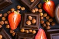 Dark chocolate, fresh strawberries, gourmet antioxidant assortment flavor nuts on a dark background