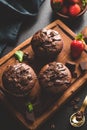 Dark chocolate muffins on wooden board Royalty Free Stock Photo