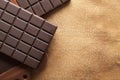Dark chocolate on old paper background Royalty Free Stock Photo