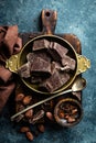 Dark chocolate pieces crushed and cocoa beans. Chocolate background Royalty Free Stock Photo