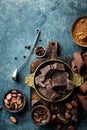 Dark chocolate pieces crushed and cocoa beans, culinary background Royalty Free Stock Photo