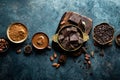 Dark chocolate pieces crushed and cocoa beans, culinary background Royalty Free Stock Photo